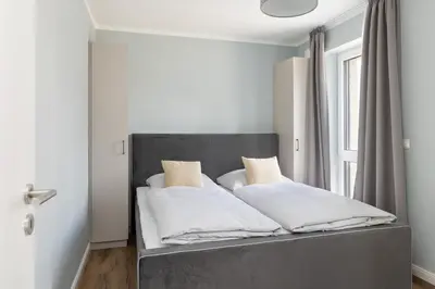 Ein Bett oder Betten in einem Zimmer der Unterkunft Sturmfrei Suite 6