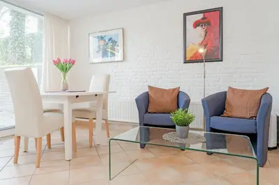 Ein Sitzbereich in der Unterkunft Haus Eva Mar am Meer Appartement 7