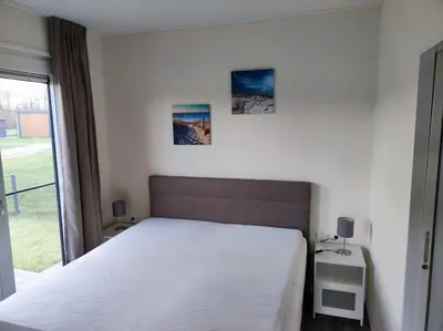 Ein Bett oder Betten in einem Zimmer der Unterkunft Chalet Seepark Süsel