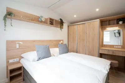 Ein Bett oder Betten in einem Zimmer der Unterkunft Ostseecamp Ferienhaus 