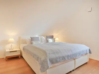 Ein Bett oder Betten in einem Zimmer der Unterkunft 3 Meeresperlen Strandhaus