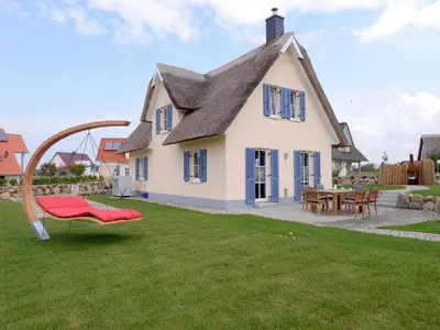 Ein Garten an der Unterkunft Arielle Ferienhaus
