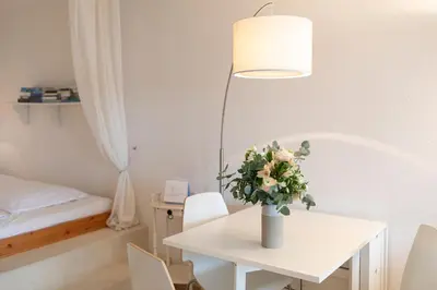 Ein Bett oder Betten in einem Zimmer der Unterkunft Lieblingsnest im Plaza Hotel
