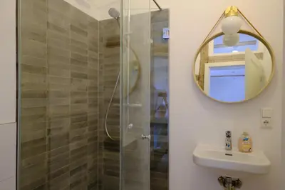 Ein Badezimmer in der Unterkunft Gutshaus KVH FeWo Warnemünde