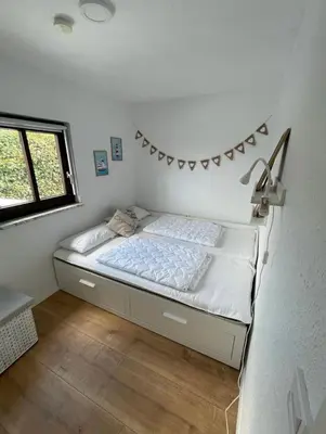 Ein Bett oder Betten in einem Zimmer der Unterkunft Haffkrug Beach Bungalow