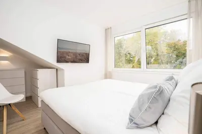 Ein Bett oder Betten in einem Zimmer der Unterkunft SEASIDE - Neubau mit Meeresblick