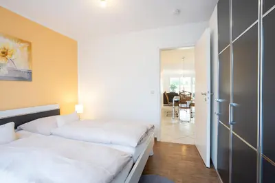 Ein Bett oder Betten in einem Zimmer der Unterkunft Seesand Nr 3