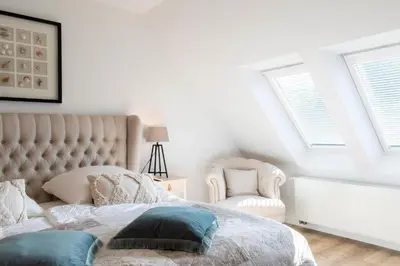 Ein Bett oder Betten in einem Zimmer der Unterkunft Ferienhaus Das Kleine Strandhaus Scharbeutz