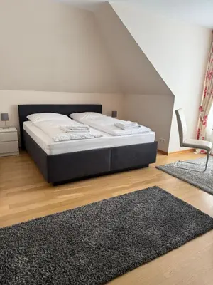 Ein Bett oder Betten in einem Zimmer der Unterkunft Dünenhaus