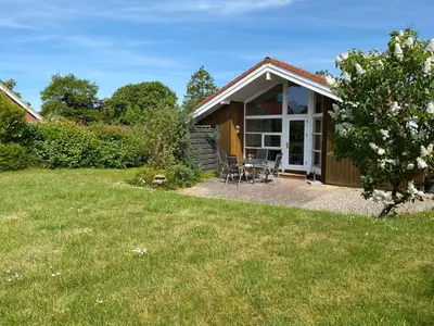 Ein Garten an der Unterkunft Timmenhus - Ferienhäuser am Feldrand