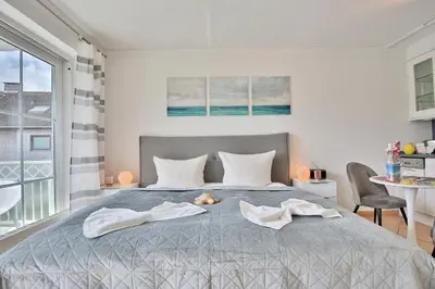 Ein Bett oder Betten in einem Zimmer der Unterkunft Residenz am Kurpark Residenz am Kurpark Appartement 5