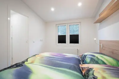 Ein Bett oder Betten in einem Zimmer der Unterkunft Ostseecamp Ferienhaus 