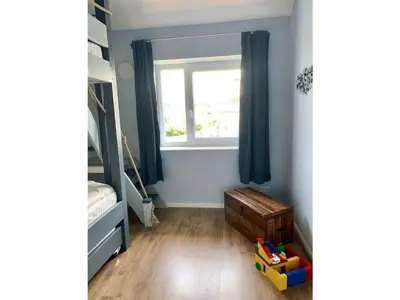 Ein Bett oder Betten in einem Zimmer der Unterkunft Ferienwohnung Seepferdchen Finnlandring