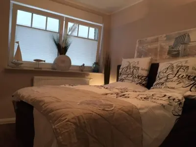 Ein Bett oder Betten in einem Zimmer der Unterkunft StrandVILLA Scharbeutz