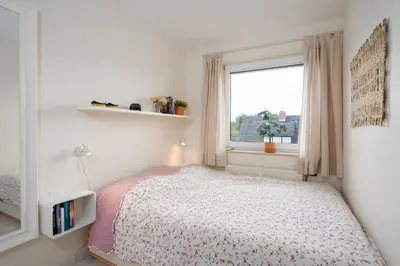 Ein Bett oder Betten in einem Zimmer der Unterkunft DKK1f Ferienwohnung 