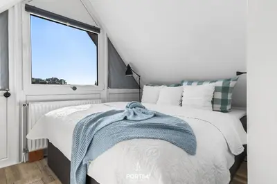 Ein Bett oder Betten in einem Zimmer der Unterkunft FW Happy Lounge Haffkrug