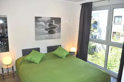 Ein Bett oder Betten in einem Zimmer der Unterkunft Domizil am Meer Nr 15 Ferienwohnung Meerblick