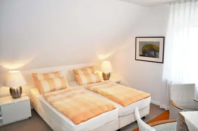 Ein Bett oder Betten in einem Zimmer der Unterkunft Gästehaus Steinhardt Ferienwohnung Nr 03