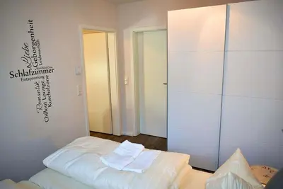 Ein Bett oder Betten in einem Zimmer der Unterkunft Hansehuus Ferienwohnung
