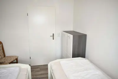 Ein Bett oder Betten in einem Zimmer der Unterkunft Haus Seeburg Ferienwohnung Nr 01