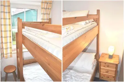 Ein Bett oder Betten in einem Zimmer der Unterkunft Haus Windrose Ferienwohnung Nr 01