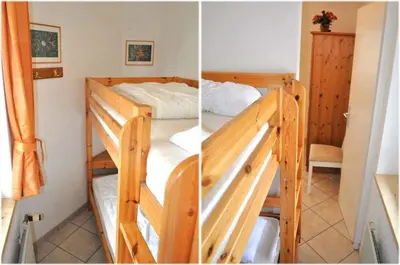 Ein Bett oder Betten in einem Zimmer der Unterkunft Haus Windrose Ferienwohnung Nr 08
