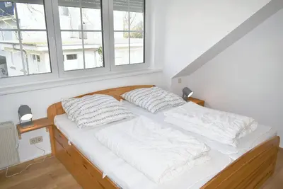 Ein Bett oder Betten in einem Zimmer der Unterkunft Haus Windrose Ferienwohnung Nr 16