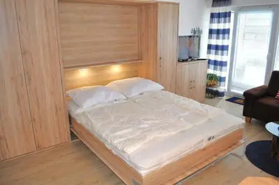 Ein Bett oder Betten in einem Zimmer der Unterkunft Leuchtturm Appartement