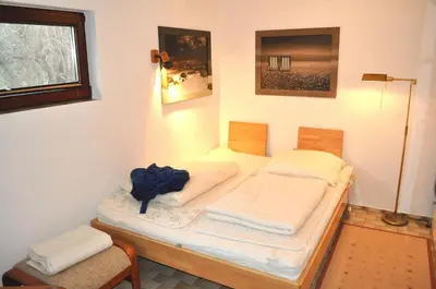 Ein Bett oder Betten in einem Zimmer der Unterkunft Lille Hus Ferienhaus