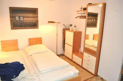 Ein Bett oder Betten in einem Zimmer der Unterkunft Lille Hus Ferienhaus