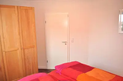 Ein Bett oder Betten in einem Zimmer der Unterkunft Ostseeallee 1 Ferienwohnung Jolle