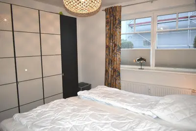 Ein Bett oder Betten in einem Zimmer der Unterkunft Residenz Johannsens Ferienwohnung Nr 04