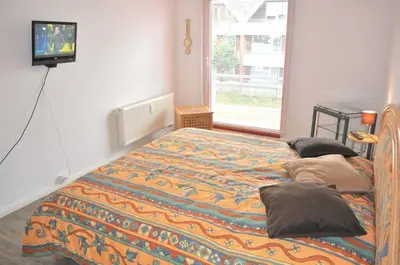 Ein Bett oder Betten in einem Zimmer der Unterkunft Residenz Niendorf Ferienwohnung Nr 09