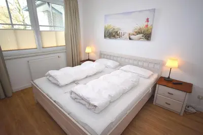 Ein Bett oder Betten in einem Zimmer der Unterkunft Residenz Niendorf Ferienwohnung Nr 32