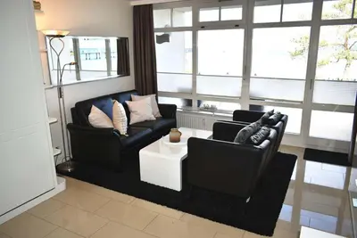 Ein Sitzbereich in der Unterkunft Strandhotel Appartement Nr 14 Meerblick