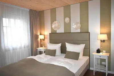 Ein Bett oder Betten in einem Zimmer der Unterkunft Villa Somersby Ferienwohnung Nr 04