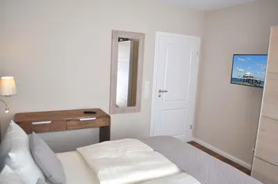Ein Bett oder Betten in einem Zimmer der Unterkunft Villa Somersby Ferienwohnung Nr 05
