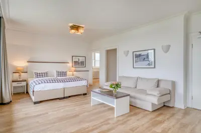 Ein Bett oder Betten in einem Zimmer der Unterkunft Ferienwohnungen Strandgrün