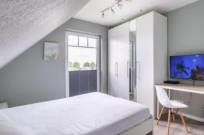 Ein Bett oder Betten in einem Zimmer der Unterkunft Ferienhaus Fine