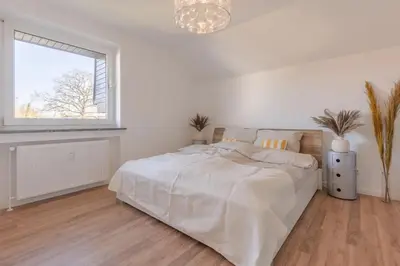 Ein Bett oder Betten in einem Zimmer der Unterkunft Ostseeparadies mit Garten, 3 Zimmer, strandnah