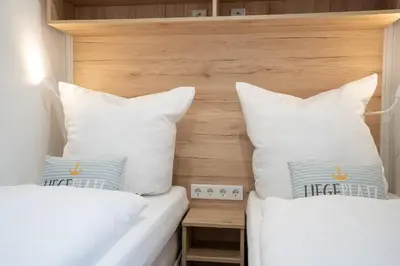 Ein Bett oder Betten in einem Zimmer der Unterkunft Ostseecamp 