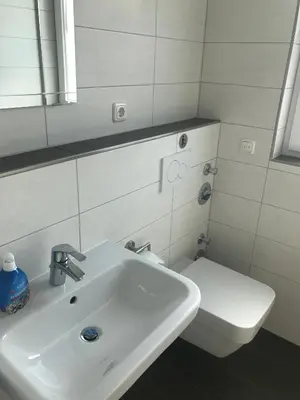 Ein Badezimmer in der Unterkunft Haus Tulle - 2 Ferienwohnungen Schnupp & Lütte mit Saisonstrandkorb