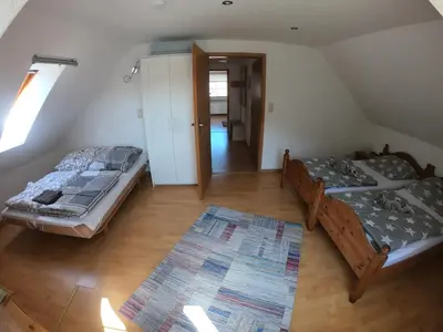 Ein Bett oder Betten in einem Zimmer der Unterkunft FeWo-Biewald