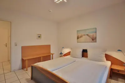 Ein Bett oder Betten in einem Zimmer der Unterkunft Maison Baltique Niendorf Appartement 15