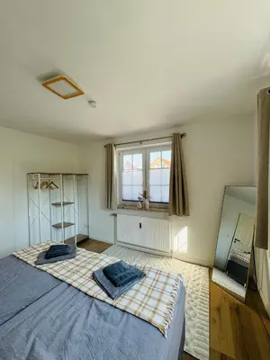 Ein Bett oder Betten in einem Zimmer der Unterkunft Familientraum an der wunderschönen Ostsee in Scharbeutz - Strandnah, kostenloses Parken & Terasse!W2