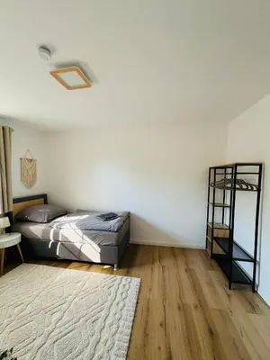 Ein Bett oder Betten in einem Zimmer der Unterkunft Familientraum an der wunderschönen Ostsee in Scharbeutz - Strandnah, kostenloses Parken & Terasse!W2
