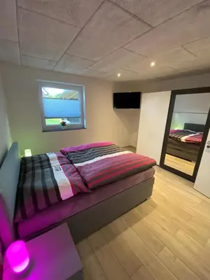 Ein Bett oder Betten in einem Zimmer der Unterkunft NEU! Modernes Ferienhaus Schwanbeck mit Whirlpool-Option