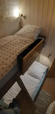 Ein Bett oder Betten in einem Zimmer der Unterkunft Ferienwohnung Kontor im Traufenhaus
