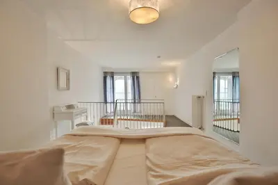 Ein Bett oder Betten in einem Zimmer der Unterkunft Haus Miramar Treffert Appartement 21