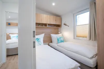 Ein Bett oder Betten in einem Zimmer der Unterkunft Ostseecamp Ostseebrise